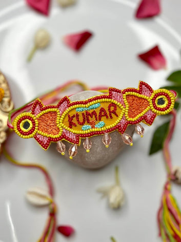 Customized Handcrafted Name Rakhi with Beads, Resham Thread & Mirror Work With Roli-Chawal