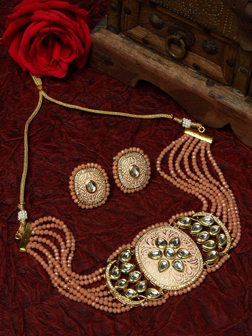 Gold-Plated Peach-Coloured & White Kundan & Onyx-Studded & Beaded Hand Painted Meenakri Jewellery Set