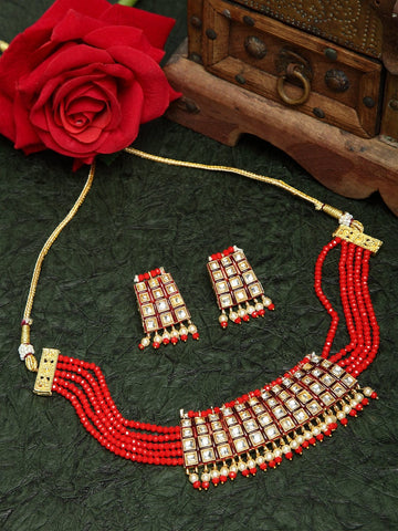 Kundan Pearls and Red Onyx Stones Studded Gold Plated Handcrafted Jewelry Set