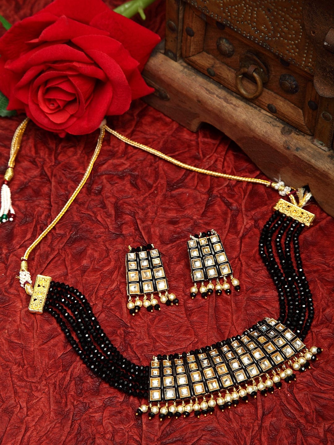 Kundan Pearls and Black Onyx Stones Studded Gold Plated Handcrafted Jewelry Set
