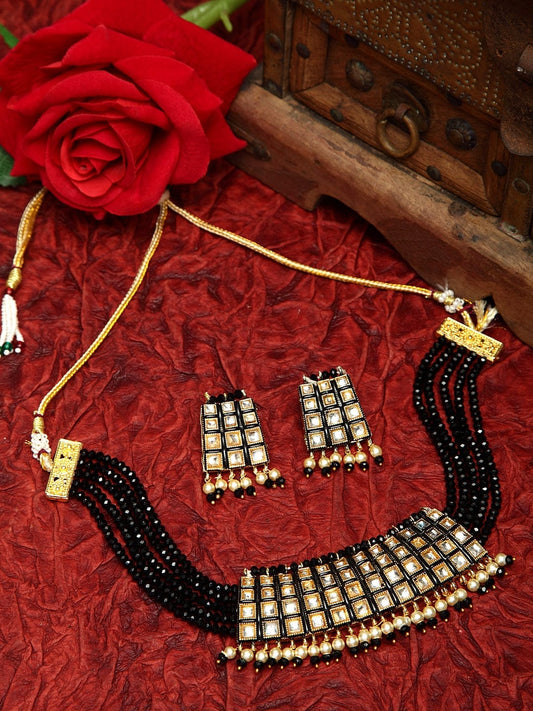 Kundan Pearls and Black Onyx Stones Studded Gold Plated Handcrafted Jewelry Set