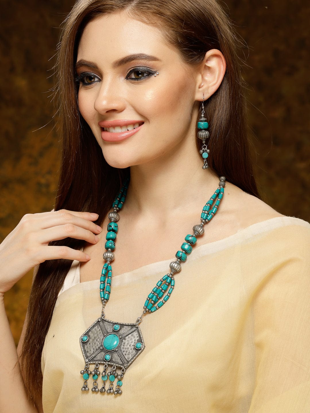 Turquoise Stone Studded Tribal Design Tesseled Pendent Set